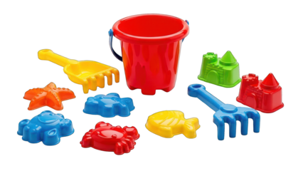 Colorful plastic sand toys pail, shovel, rakes, starfish, crab, fish, castles, against black