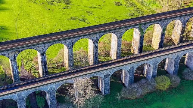 A close up rotating aerial view on the south side of the viaduct and aqueduct at Chirk, Wrexham, Wales