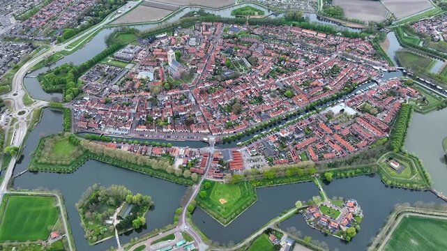 Aerial views of the historic fortified  town of Brielle, Den Briel, The Netherlands. View from the drone of star-shaped Fort Brielle showcasing canals, historic architecture, and vibrant cityscape