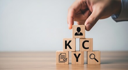 Hand placing wooden block with person on of K Y C blocks on table wooden blocks person document checkmark