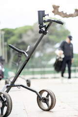 A golf cart is parked on the sidewalk