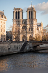 Notre-Dame Cathedral in Paris seen from the cobbled quays of Paris in winter 1