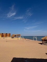 Obraz premium Quite sandy beach with blue sky and copy space in Newuibaa 