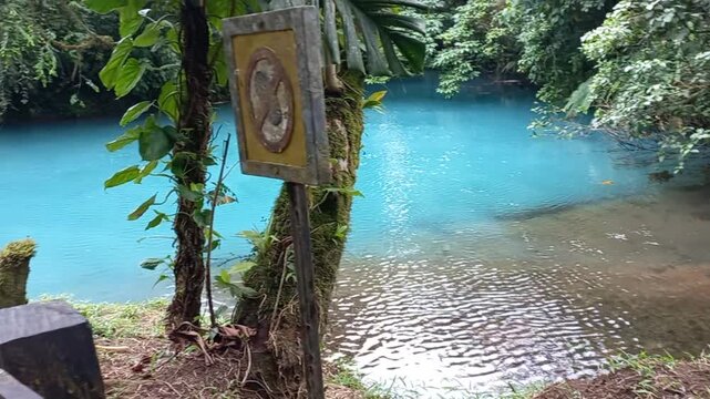 Capturing the legendary beauty of Rio Celeste in Costa Rica, where local lore says God washed his brushes after painting the sky. This footage shows the vibrant turquoise water and lush rainforest of 