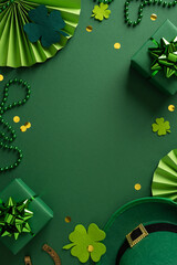 Obraz premium Vibrant vertical green holiday scene featuring shamrocks, hats, beads, gift boxes, and confetti ideal for St Patrick's Day greeting and seasonal inspiration