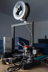 3D printer creates a plastic prototype using additive manufacturing in a professional workspace with emphasis on precision technology.