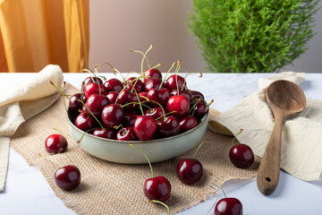 Bowl filled with fresh red cherries.