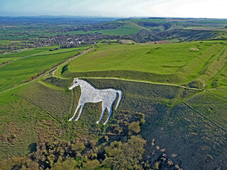 Aerial view of Bratton Camp iron age fort and Westbury white horse in Wiltshire	