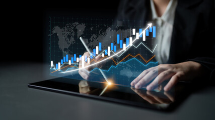 A professional analyzes stock market trends on a tablet, showcasing digital graphs and charts. Perfect for finance, strategy, and business growth themes. Impute