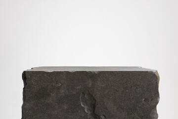 Obraz na płótnie Canvas Minimalist stone podium with a rough natural texture. Stone wall, stone slab for product display background. 3d illustration