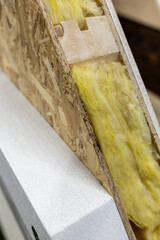 Wooden wall with thermal insulation