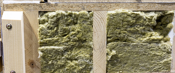 Wooden wall with thermal insulation