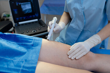 Naklejka na ściany i meble Leg ultrasound for vein check by vascular surgeon.
