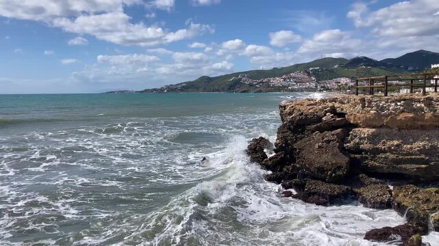Wonderful landscapes of the shimmering sea and charming city unfold, offering breathtaking coastal views and a picturesque atmosphere in Nerja, Spain