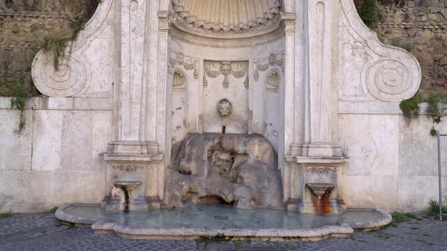 Fontana del Prigione also known as the Fountain of the Prisoner, a historic 16th-century Roman fountain located on Janiculum Hill in Trastevere neighborhood of Rome, Italy.