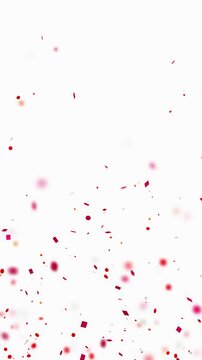 Confetti explosion. Animation of red confetti on a white background with depth of field in vertical format.