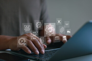 Business professional using laptop with logistics icons, AI technology, global supply chain, automation, data analytics, smart delivery, digital transformation and modern business management concept.