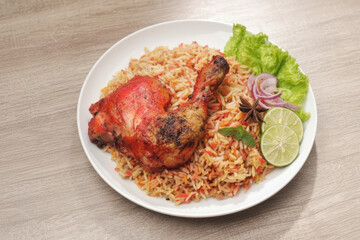 Fototapeta premium Authentic Chicken Biryani Plate with Spiced Rice and Fresh Garnish