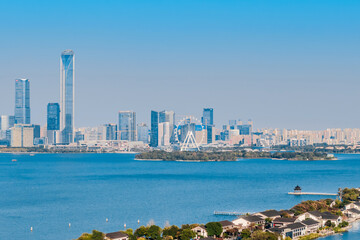 Aerial view of the skyline of Ligong Causeway and Huxin Pavilion in Jinji Lake, Suzhou, Jiangsu Province, China. © Govan