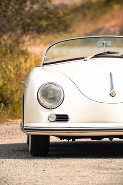 1957 Porsche 357 Speedster replica parked on a hot sunny day close up vertical