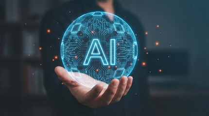 A person holding a glowing blue sphere with "AI" text and circuit patterns, representing artificial intelligence technology.