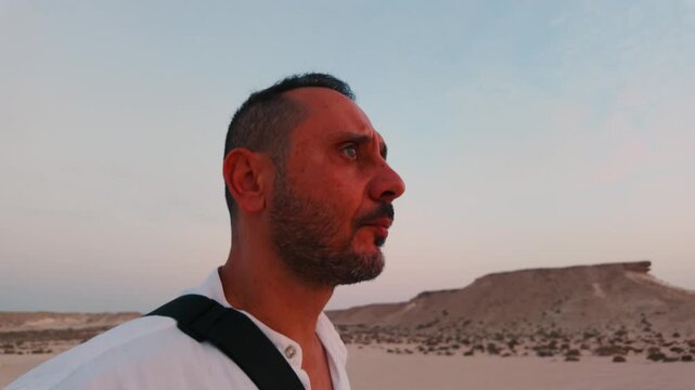 Tourist man enjoy desert safari in Zekreet, Qatar at the sunset time