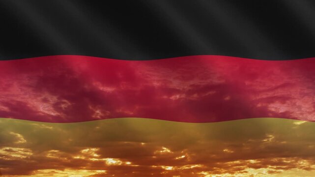 Flag of Germany waving against a vibrant sunset, creating a patriotic and inspiring atmosphere with warm tones.
