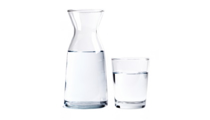 Clear glass carafe filled with water alongside a matching glass on a white background symbolizing hydration for sunexposed skin recovery.