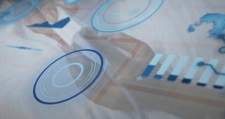 Manipulating female pro in blazer, touching tablet at office desk, HUD, bar chart, map, arrow