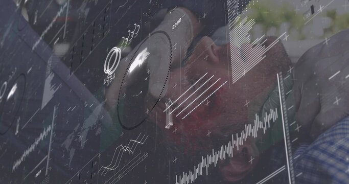 Reclining man wearing eyeglasses and plaid shirt merging with HUD overlays in control room, gauges - Powered by Adobe