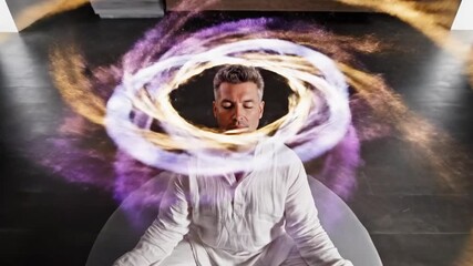 A woman sits cross-legged on a cushion, eyes closed, with a vibrant cosmic energy swirling around her head