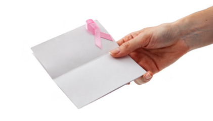 Closeup of a nurses hand presenting a medical leaflet with a small ribbon attached at bedside highlighting compassionate patient care and education.