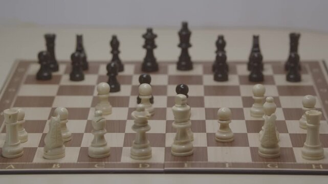 Standard piece development during the Grob's Attack.  The White player improves his position by moving his pawn to c4 to strengthen the center and attack the Black pawn.