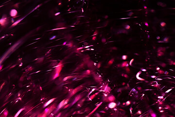 Dynamic Abstract Magenta Light Trails and Bokeh on Dark Background