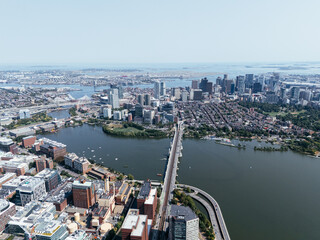 Aerial view of Boston skyline with Zakim Bridge, highways, Charles River and downtown cityscape on sunny day. g.