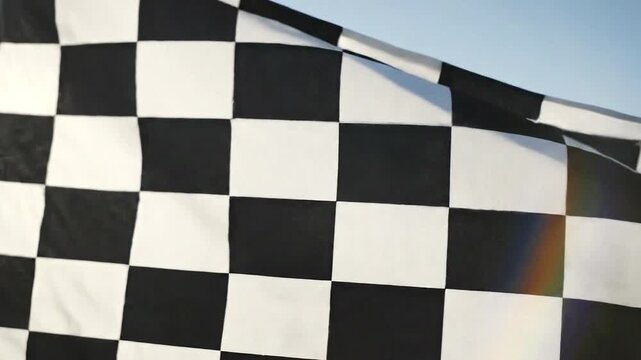 Waving checkered racing flag closeup.