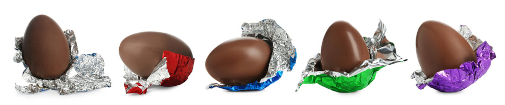 Tasty chocolate eggs wrapped in shiny foil isolated on white, set