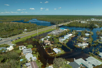 Aftermath of natural disaster. Surrounded by hurricane Ian rainfall flood waters homes in Florida residential area