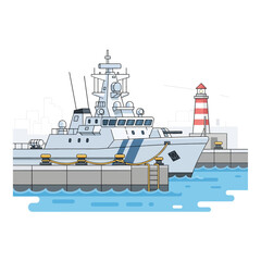 Ship docked at harbor with lighthouse in background