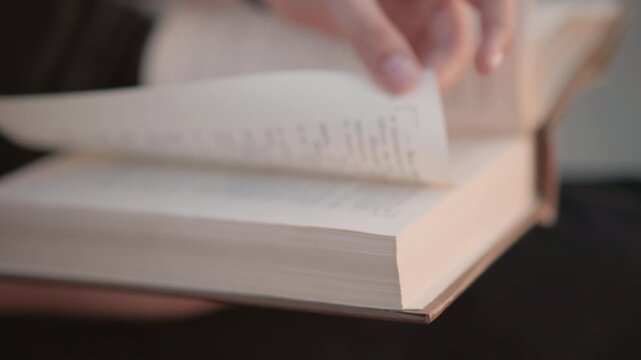 Focused woman examines text attentively, Caucasian female seller examines script with precision, Caucasian woman carefully turns pages while examining paragraphs in quiet indoor setting