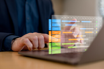 Project management, scheduling, workflow planning, data tracking, productivity analysis and modern business technology concept.Business professional using laptop with virtual project timeline and prog
