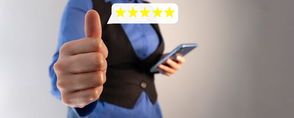 A businesswoman holding a smartphone with her hand, giving a thumbs up, and a five-star rating speech bubble icon.