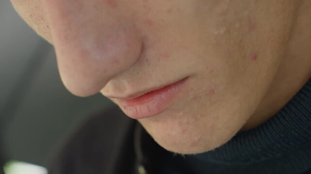 close up caucasian man lips and chin, soft indoor light, turtleneck sweater, subtle pensive expression, actor rehearsing lines, pretending to speak, slight acne and stubble visible, intimate cinematic