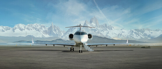 private jet airplane on the ground waiting to be boarded snowy mountains in the background © bruno