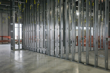 Metal framework standing tall within the expansive interior of a commercial building, capturing the...