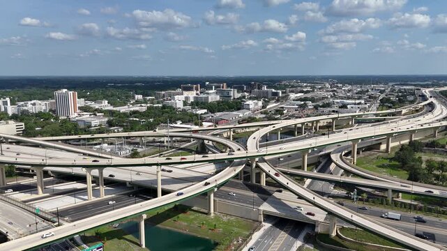 Still shot of cars passing through the I-4 and 408 freeway interchange at downtown Orlando in Orange County, Florida. 