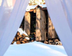 Stack of Chopped Firewood with Light Snow in Winter Environment