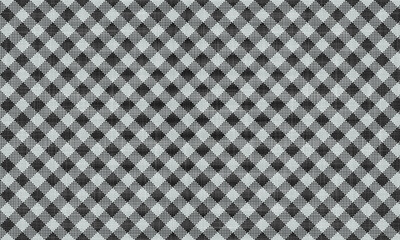 Close up of a black and white checkered fabric pattern with a repeating diagonal square design style