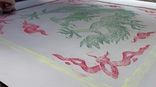 Time-lapse of charcoal rubbing, tracing Japanese dragon street art