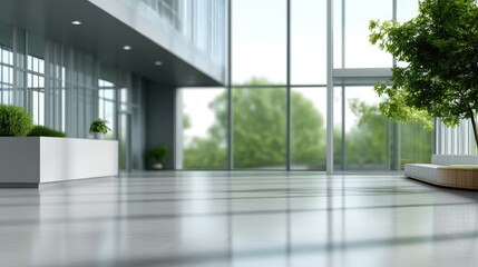 Fototapeta premium Modern interior of a spacious lobby showcasing large windows, natural light, minimalist design, and vibrant greenery in an urban building environment.